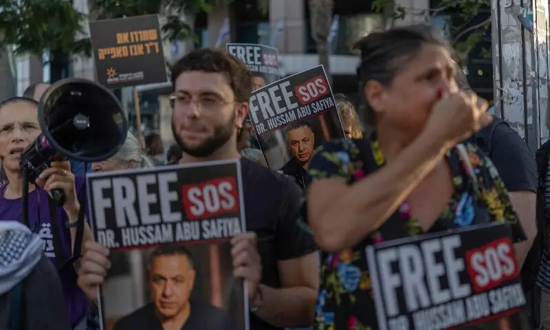 Israeli left wing activist hold placards and chant slogans in Tel Aviv on July 6, 2026, during a rally calling for release of Palestinian Gaza Doctor Hussan Abu Safiya, detained by Israeli forces since December 2024. — AFP Israeli left wing activist hold placards and chant slogans in Tel Aviv on July 6, 2026, during a rally calling for release of Palestinian Gaza Doctor Hussan Abu Safiya, detained by Israeli forces since December 2024. — AFP