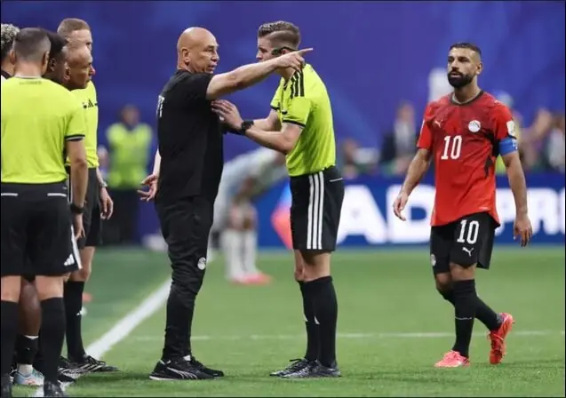 French referee Francois Letexier speaks with Egyptian team official. — AFP French referee Francois Letexier speaks with Egyptian team official. — AFP
