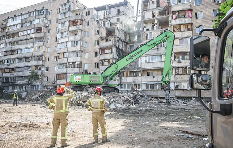 RESCUERS work at the site of a Russian missile and drone strike in Ukraine during which a residential building was heavily damaged.&mdash;Reuters