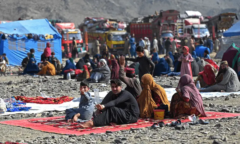 Afghan refugees rest at a makeshift camp upon their arrival from Pakistan, near the Afghanistan-Pakistan Torkham border in Nangarhar province on November 2, 2023. — AFP/File Afghan refugees rest at a makeshift camp upon their arrival from Pakistan, near the Afghanistan-Pakistan Torkham border in Nangarhar province on November 2, 2023. — AFP/File