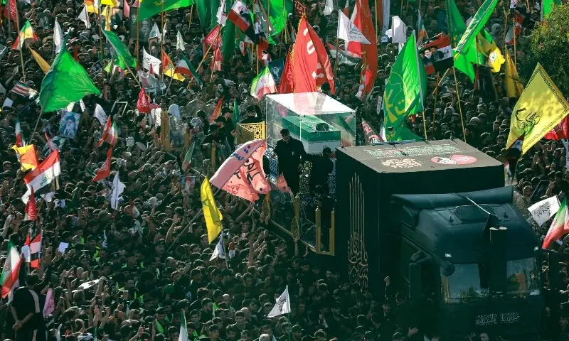 Crowds of mourners gather around an unseen vehicle transporting the coffin of Iran&rsquo;s slain supreme leader Ali Khamenei during a funeral procession in Najaf on July 8, 2026. &mdash;AFP