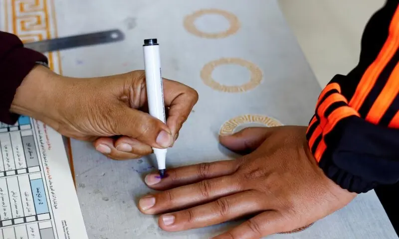 A polling official marks the finger of a Palestinian voter with ink during the municipal election at a polling station in Deir al-Balah, central Gaza Strip April 25, 2026. — Reuters A polling official marks the finger of a Palestinian voter with ink during the municipal election at a polling station in Deir al-Balah, central Gaza Strip April 25, 2026. — Reuters