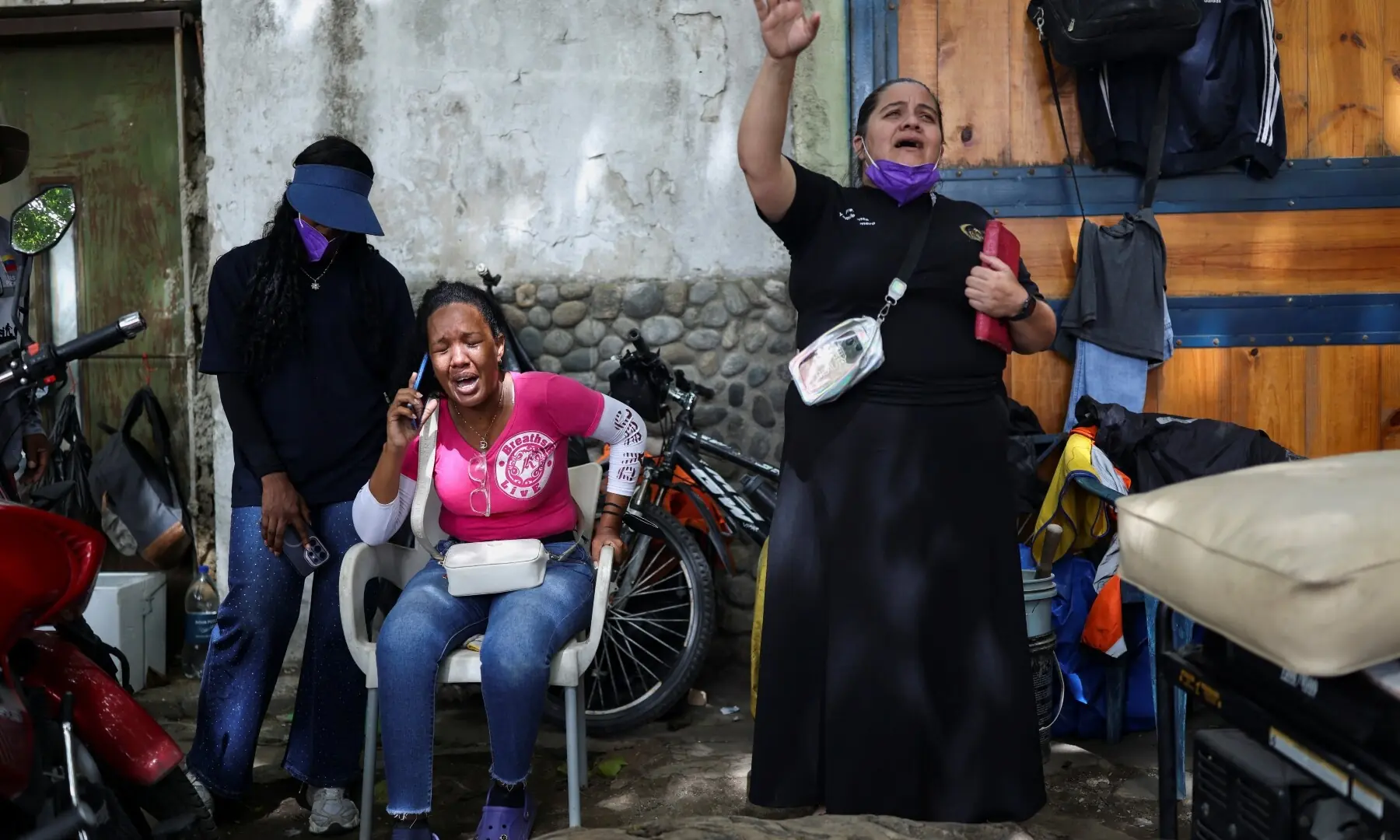 Dayana Millan cries after learning that her son was found dead, while a woman prays beside her following the June 24 earthquakes, in La Guaira, Venezuela, July 10, 2026. — Reuters