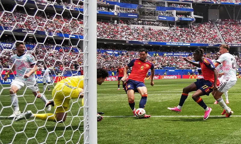 SPAIN’S Mikel Merino scores the winner past Belgium goalkeeper Senne Lammens during their quarter-final at the Los Angeles Stadium.—Reuters SPAIN’S Mikel Merino scores the winner past Belgium goalkeeper Senne Lammens during their quarter-final at the Los Angeles Stadium.—Reuters