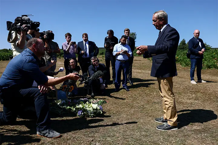 Reform UK party leader Nigel Farage speaks to the media after laying flowers near the home of former minister Ann Widdecombe in Haytor.—Reuters Reform UK party leader Nigel Farage speaks to the media after laying flowers near the home of former minister Ann Widdecombe in Haytor.—Reuters