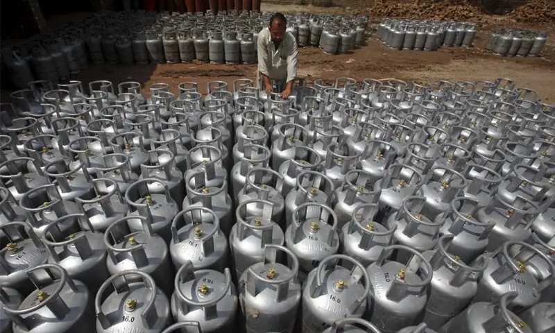 LPG cylinders being collected to dispatch. &mdash; Dawn/File