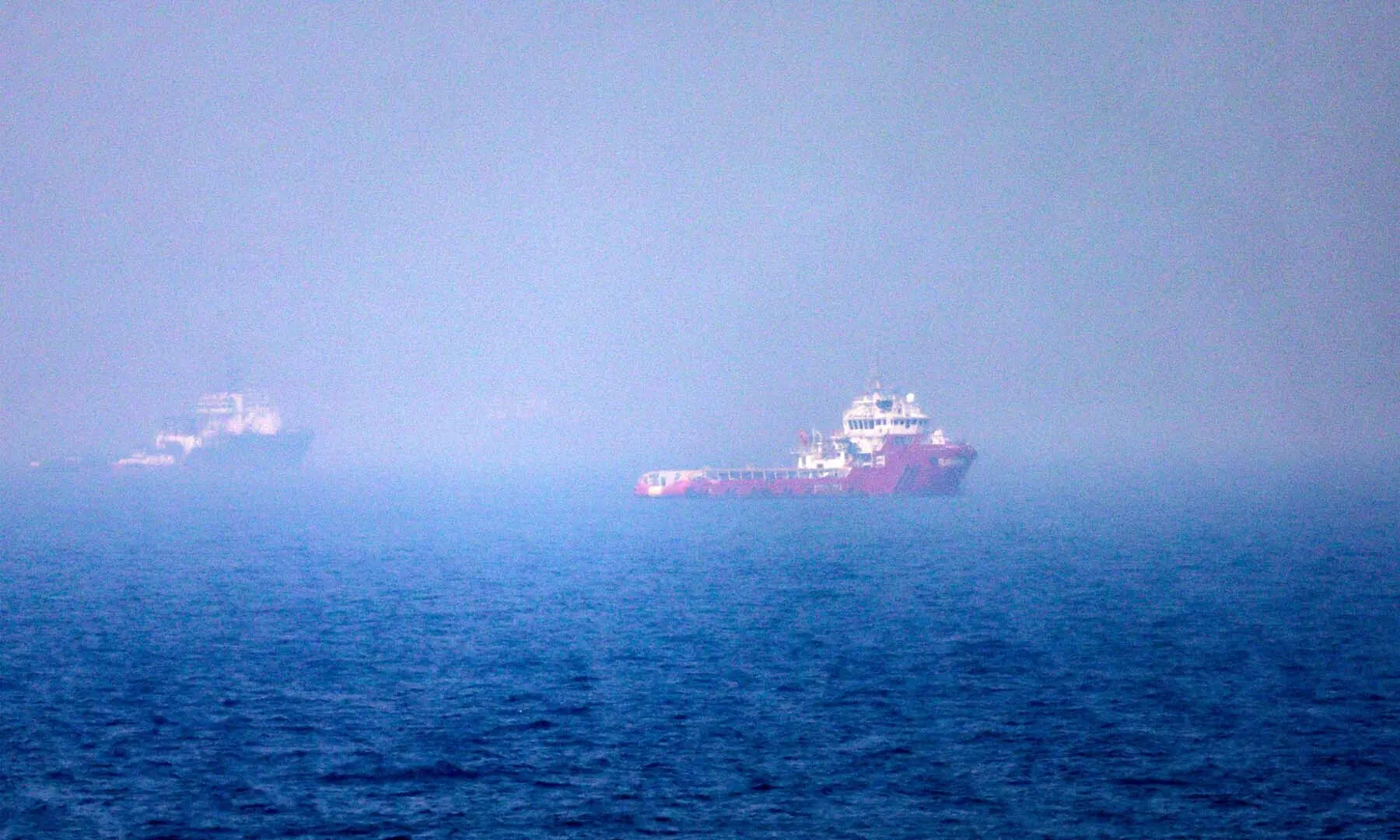 This picture shows ships sailing near the Strait of Hormuz off the eastern coast of the United Arab Emirates at Khor Fakkan on July 13, 2026. &mdash; AFP