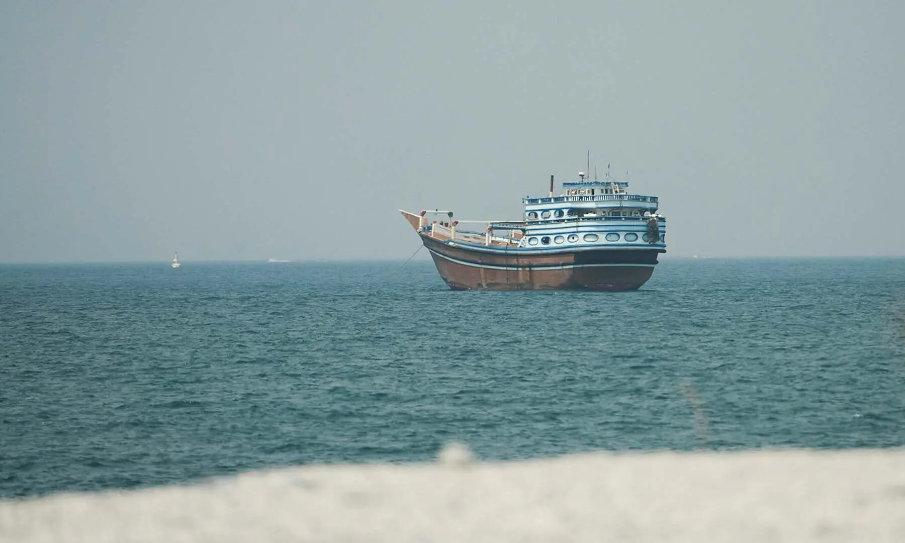 A vessel at the Strait of Hormuz, as seen from Musandam, Oman on July 13, 2026. &mdash; Reuters