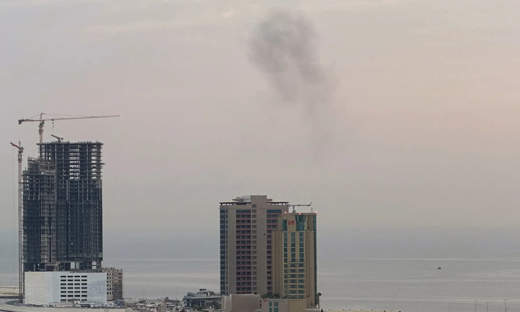 Smoke rises after a drone was intercepted during early morning hours in Manama, Bahrain on July 14, 2026. &mdash; Reuters