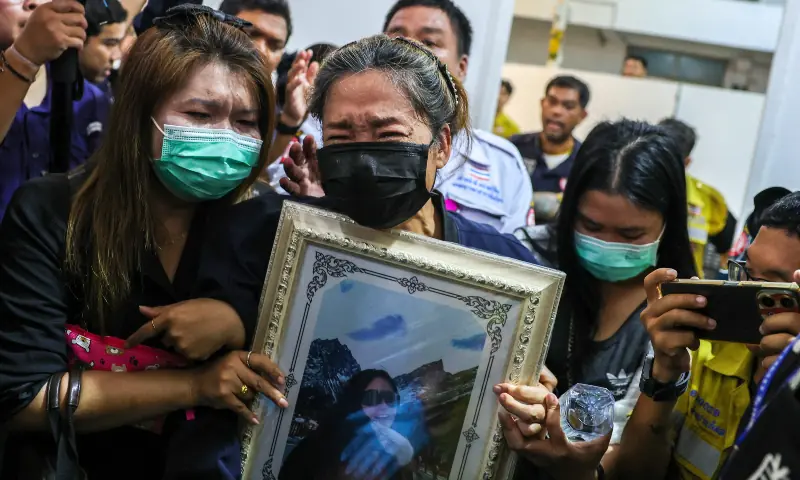 Family members react as they receive the body of a victim at the Police Hospital morgue, following a deadly fire at a pub in Bangkok, Thailand, on July 14, 2026. — Reuters Family members react as they receive the body of a victim at the Police Hospital morgue, following a deadly fire at a pub in Bangkok, Thailand, on July 14, 2026. — Reuters
