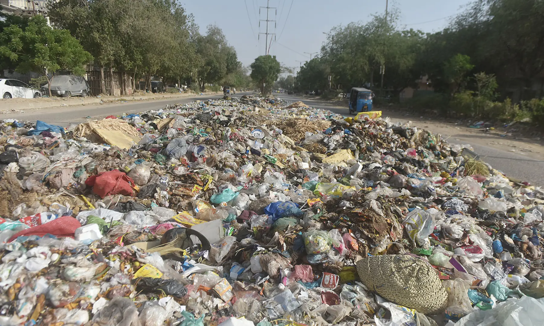 A large pile of accumulated trash on a Karachi road. &mdash; White Star