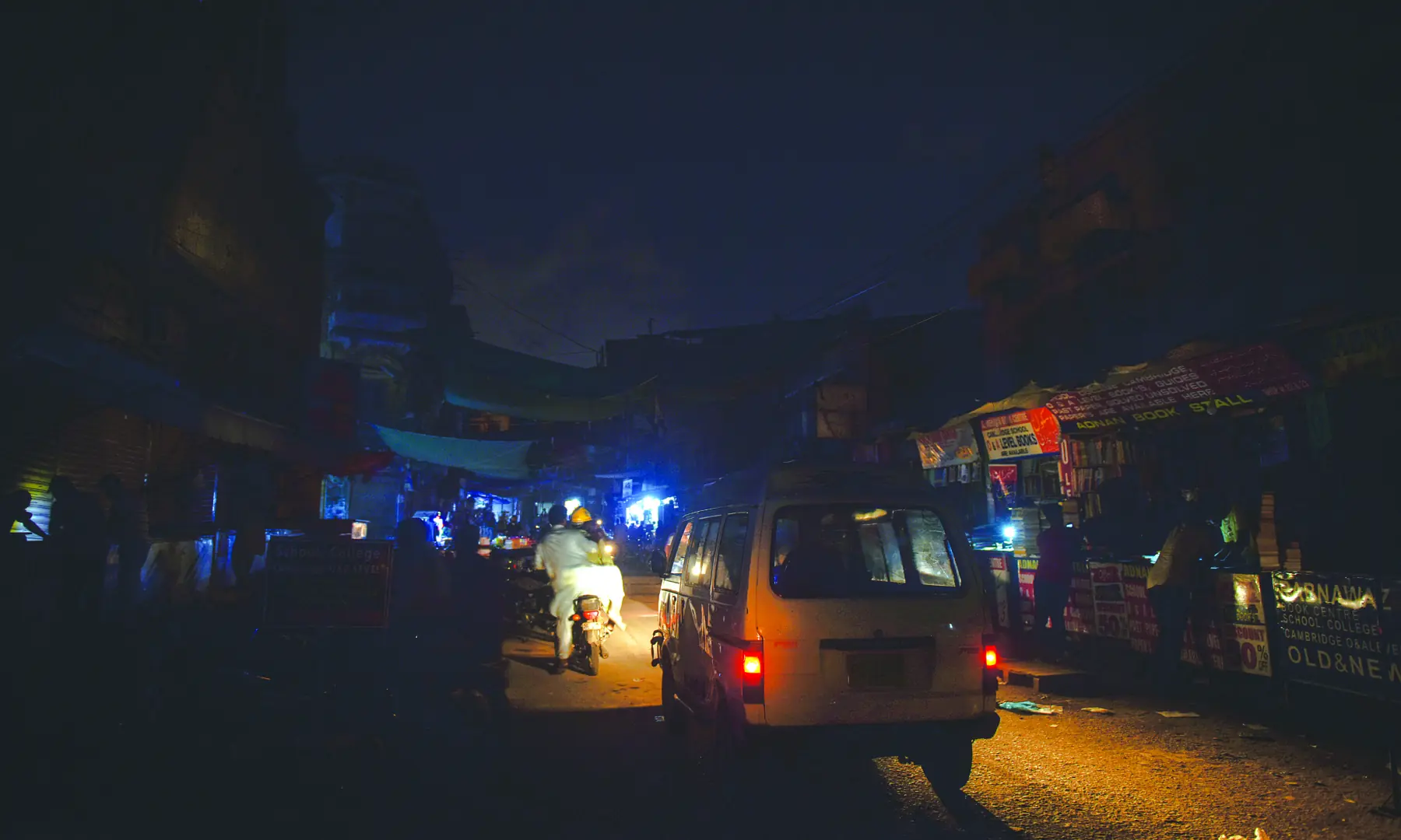 Vehicles drive along a road in darkness amid an electricity outage in Karachi. &mdash; White Star