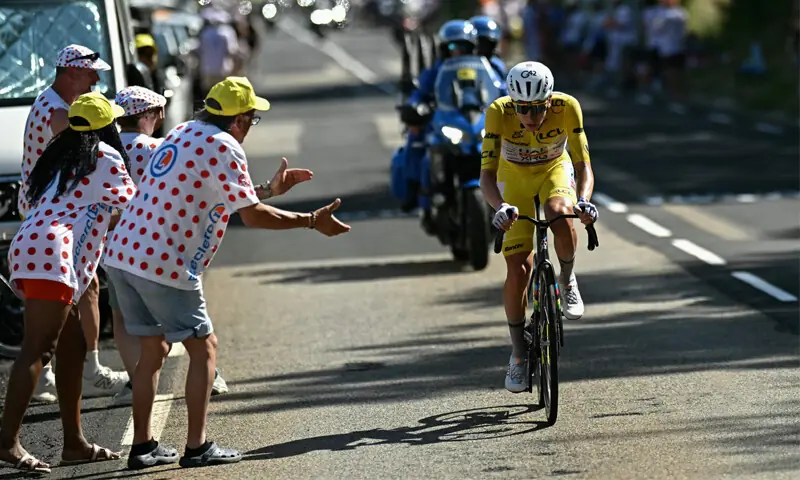 UAE Team Emirates-XRG’s Slovenian rider Tadej Pogacar wearing the overall leader’s yellow jersey cycles on his way to winning the 10th stage of the Tour de France on Tuesday.—AFP UAE Team Emirates-XRG’s Slovenian rider Tadej Pogacar wearing the overall leader’s yellow jersey cycles on his way to winning the 10th stage of the Tour de France on Tuesday.—AFP