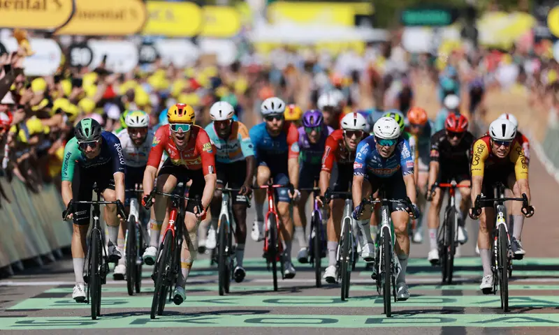UNO-X Mobility&rsquo;s Soren Waerenskjold (second L) crosses the finish line to win the 11th stage of the Tour de France on Wednesday.&mdash;Reuters