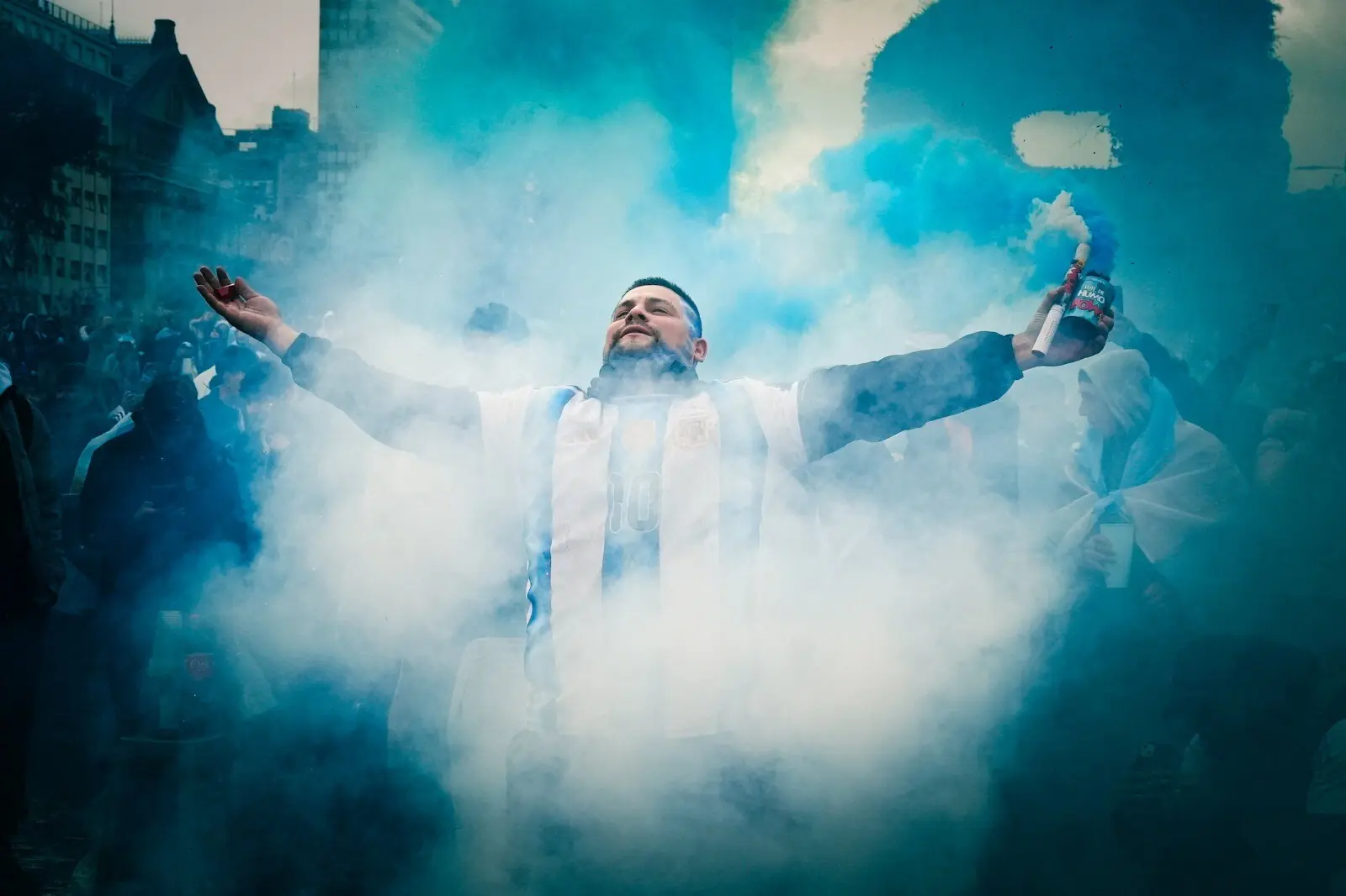 An Argentina fan holds smoke flares as supporters gather at the Obelisk in Buenos Aires, Argentina before the FIFA World Cup final between Spain and Argentina on July 19, 2026. &mdash; Reuters