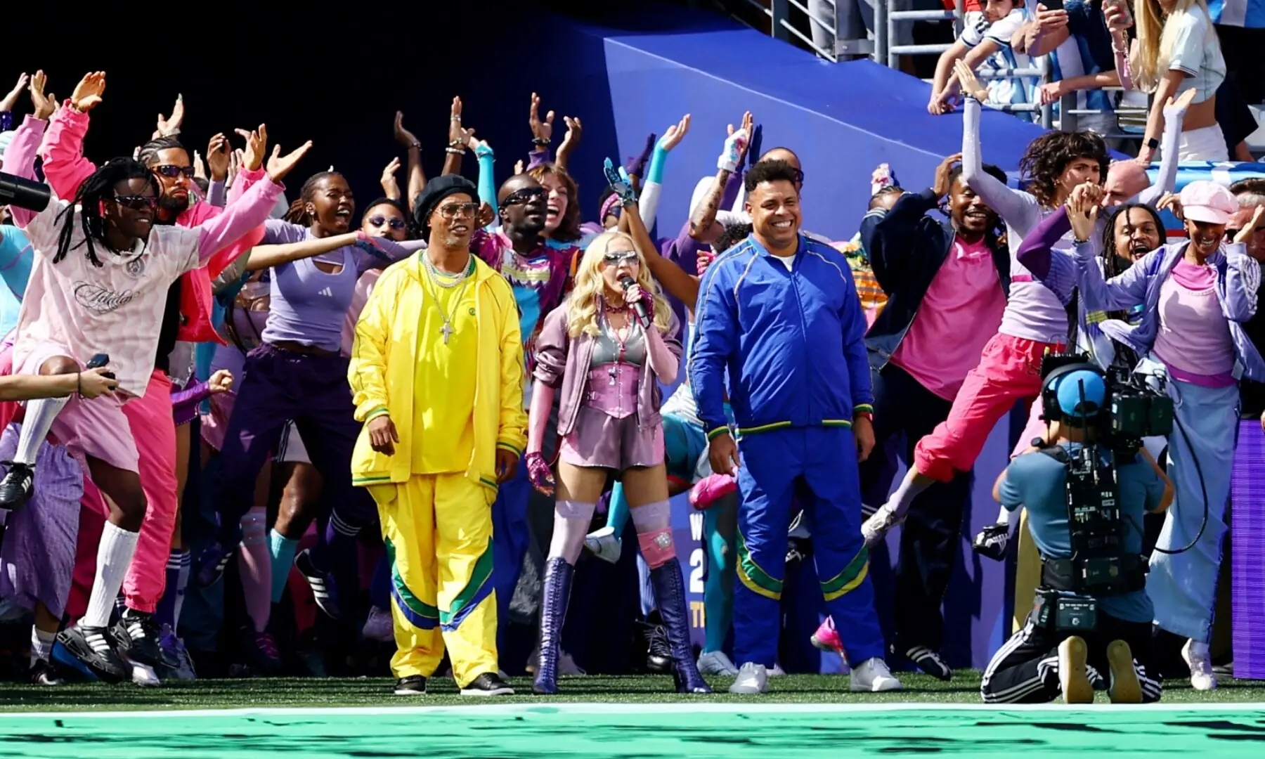 Madonna (C), flanked by former Brazil football players Ronaldinho (L) and Ronaldo (R), performs at the halftime show of the 2026 FIFA World Cup final between Spain and Argentina at the New York/New Jersey Stadium, East Rutherford, New Jersey, the US on July 19, 2026. &mdash; Reuters