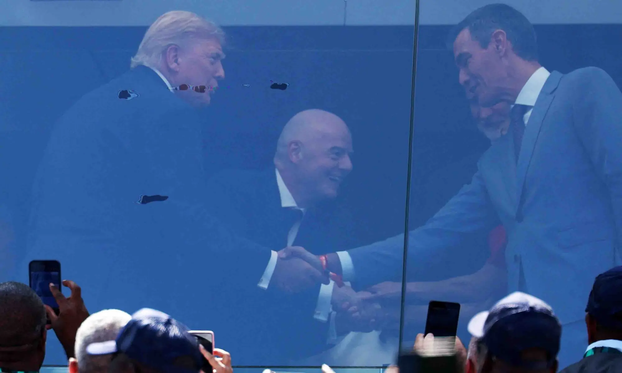 US President Donald Trump shakes hands with Spain’s Prime Minister Pedro Sanchez in the stands before the FIFA World Cup final on July 19. — Reuters