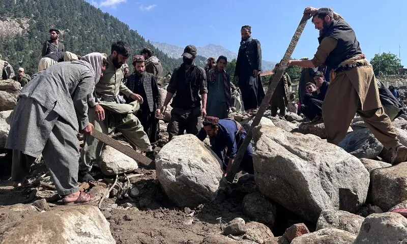 Afghan men search the debris of destroyed shops following flash floods in Parun town in Afghanistan's Nuristan province, on July 21, 2026. — AFP Afghan men search the debris of destroyed shops following flash floods in Parun town in Afghanistan's Nuristan province, on July 21, 2026. — AFP