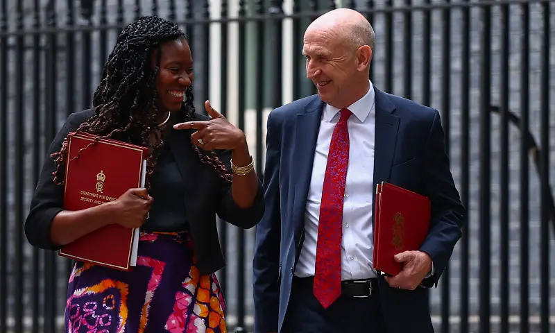 Britain’s incoming Chancellor of the Exchequer John Healey (R) walks with Britain’s Secretary of State for Energy Security and Net Zero Miatta Fahnbulleh (L) as they leave after a cabinet meeting in Downing Street in London on July 21, 2026, a day after Andy Burnham became Britain’s new prime minister. — AFP