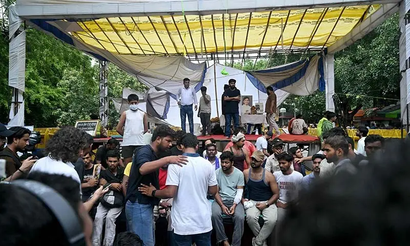 Cockroach Janta Party (CJP) founder Abhijeet Dipke (back C) looks on during a protest demanding the resignation of India’s Education Minister Dharmendra Pradhan over alleged NEET exam irregularities, in New Delhi on July 21, 2026. — AFP
