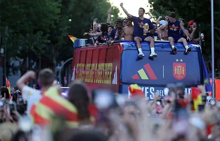 SPAIN captain Rodri holds the FIFA World Cup trophy as the team’s players parade onboard an open-top bus through the streets.—AFP SPAIN captain Rodri holds the FIFA World Cup trophy as the team’s players parade onboard an open-top bus through the streets.—AFP