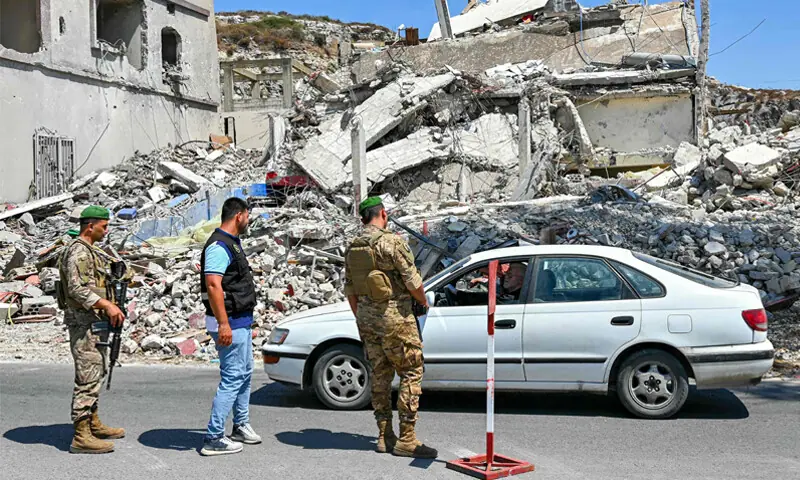 Lebanese soldiers stop a vehicle to check the documents of a motorist at a checkpoint in southern Lebanon.&mdash;AFP