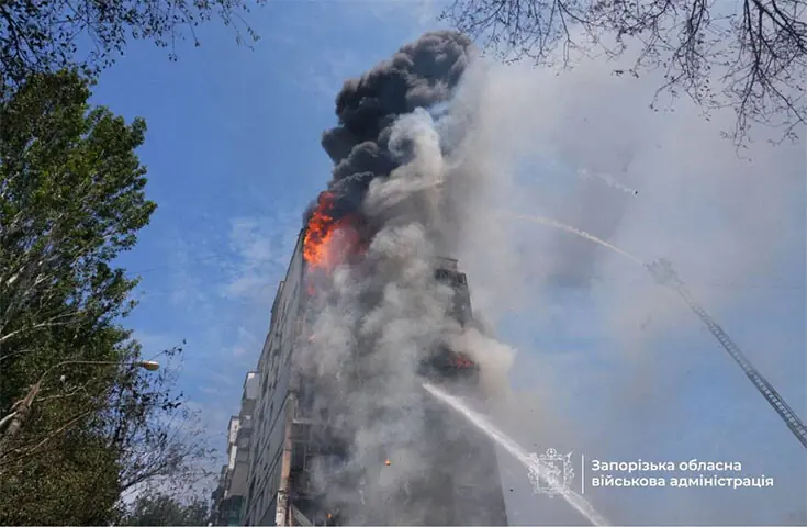 Ukrainian firefighters work to extinguish a fire in a residential building after an air strike in Zaporizhzhia.—AFP Ukrainian firefighters work to extinguish a fire in a residential building after an air strike in Zaporizhzhia.—AFP