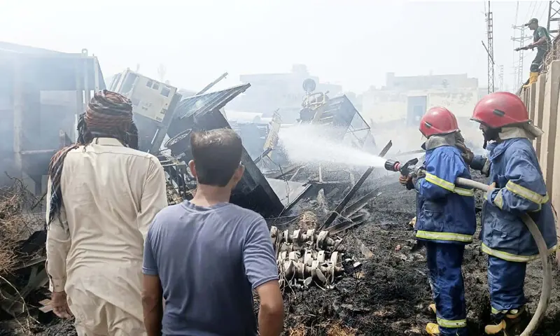 Firefighters of Rescue 1122 extinguish flames.&mdash;Umair Ali