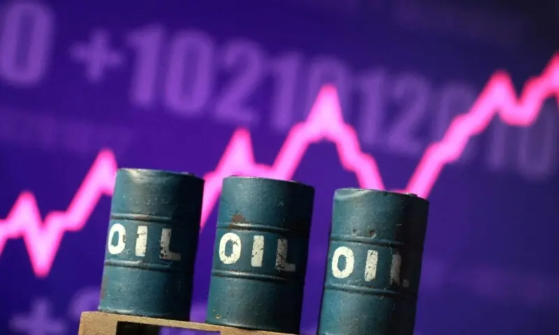 3D-printed oil barrels in front of a rising stock graph appear in this illustration. &mdash; Reuters/File