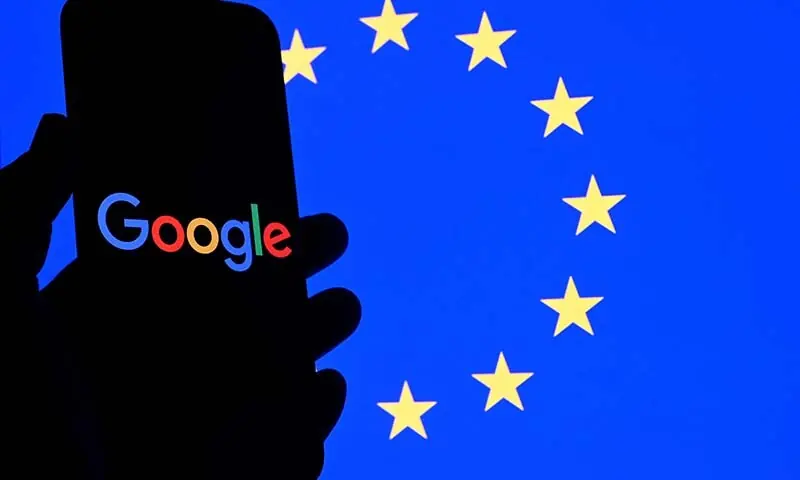 (FILES) This illustration photograph shows the logo of Google displayed on a smartphone in front of an European Union flag in Brussels on September 29, 2025. The European Union on July 23, 2026 slapped Google with two fines worth 890 million euros ($1 billion) in a move that risks raising tensions with the United States. The EU fined the US giant 460 million euros for illegally favouring the company's own services -- for example, Google Flights or Google Hotels -- over rivals in search results. (Photo by Ni (FILES) This illustration photograph shows the logo of Google displayed on a smartphone in front of an European Union flag in Brussels on September 29, 2025. The European Union on July 23, 2026 slapped Google with two fines worth 890 million euros ($1 billion) in a move that risks raising tensions with the United States. The EU fined the US giant 460 million euros for illegally favouring the company's own services -- for example, Google Flights or Google Hotels -- over rivals in search results. (Photo by Ni