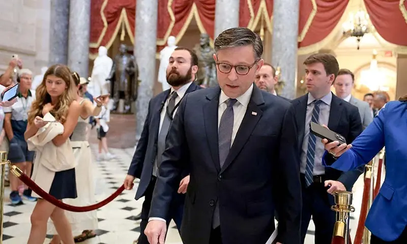 US Speaker of the House Mike Johnson is followed by reporters as he walks back to his office in the US Capitol Building on July 23, 2026 in Washington, DC, the US. — AFP