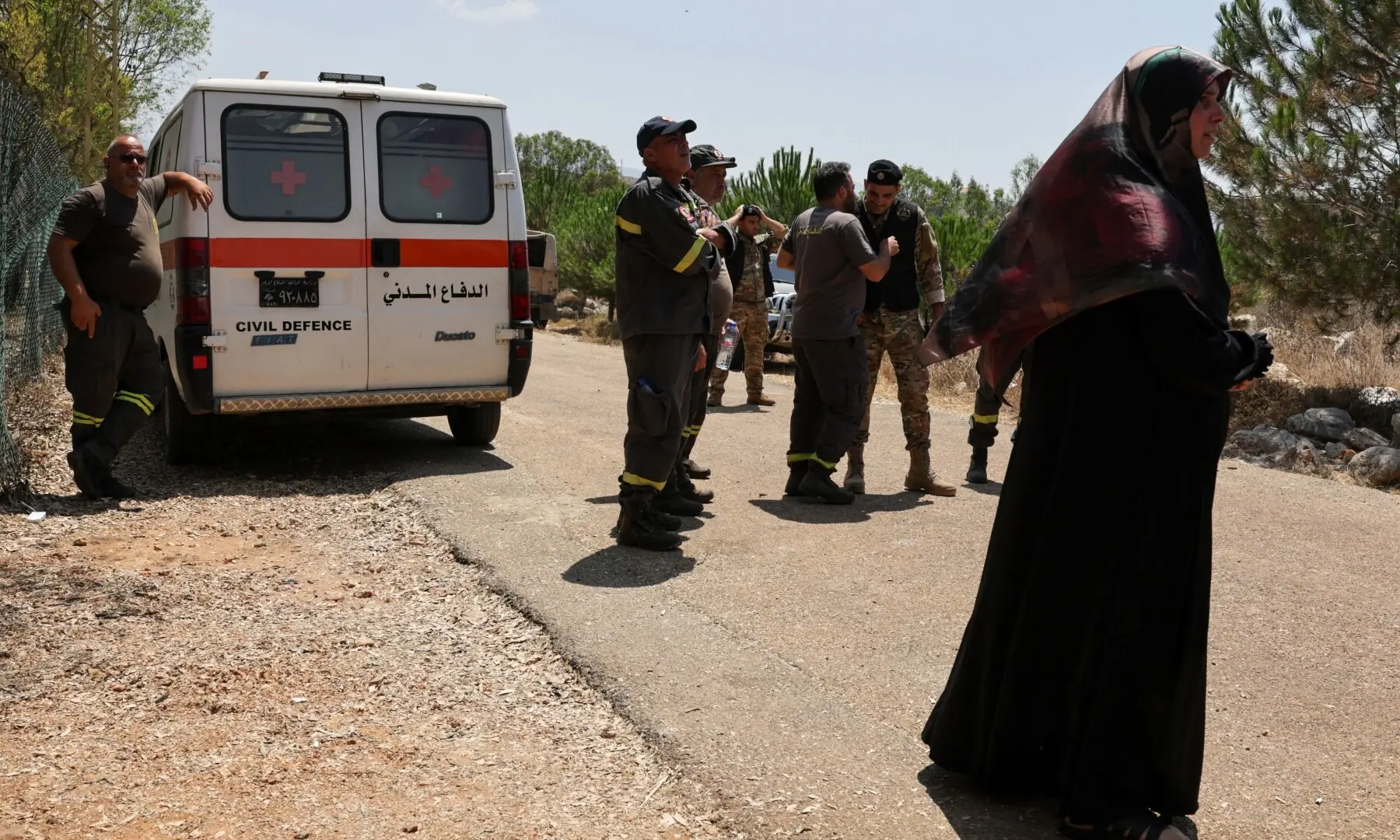 Residents, members of the Lebanese army, and civil defence gather outside Zawtar al-Gharbiyeh village, following the withdrawal of Israeli forces under a US-brokered plan, in southern Lebanon on July 23, 2026. &mdash; Reuters