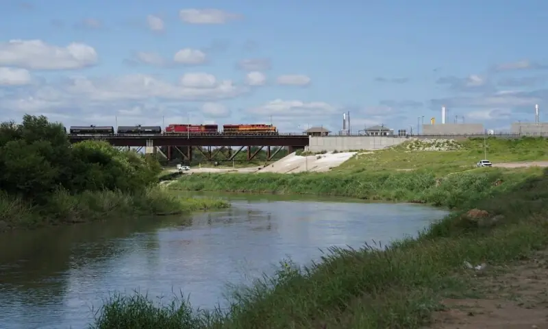 A freight train coming from Mexico crosses the border after six bodies were found on Sunday in a train boxcar, in Laredo, Texas, US May 11, 2026. &mdash; Reuters