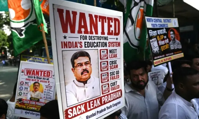People hold placards demanding resignation of Education Minister Dharmendra Pradhan at a protest in Mumbai on June 2, 2026. — AFP People hold placards demanding resignation of Education Minister Dharmendra Pradhan at a protest in Mumbai on June 2, 2026. — AFP