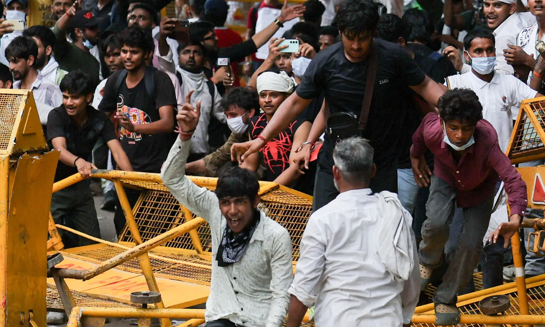  Supporters of India’s Cockroach Janta Party (CJP) break a barricade as they celebrate after India’s Education Minister Dharmendra Pradhan resigned, at Jantar Mantar in New Delhi on July 25, 2026. — Reuters 