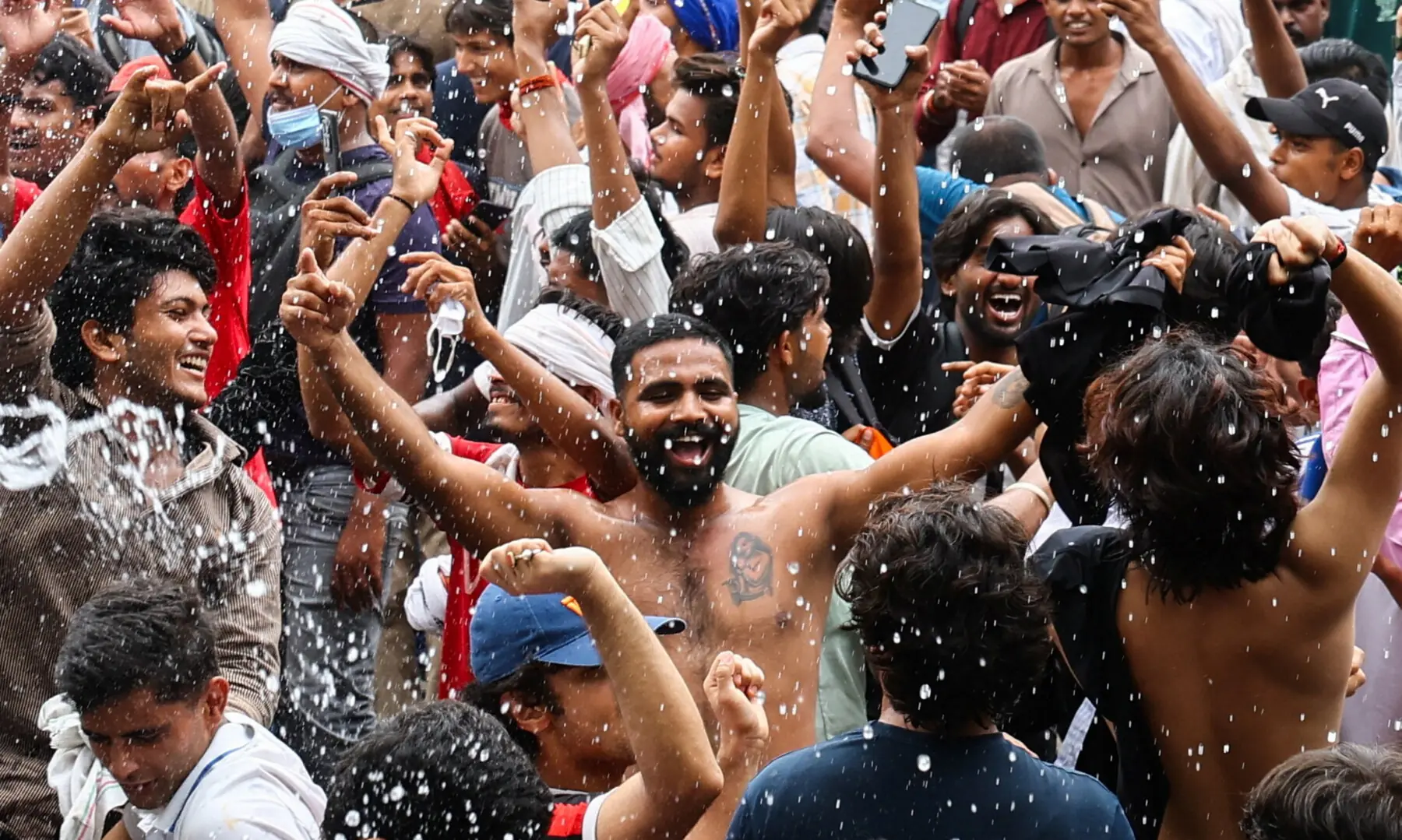  Supporters of India’s Cockroach Janta Party (CJP) celebrate after India’s Education Minister Dharmendra Pradhan resigned, at Jantar Mantar in New Delhi on July 25, 2026. — Reuters 