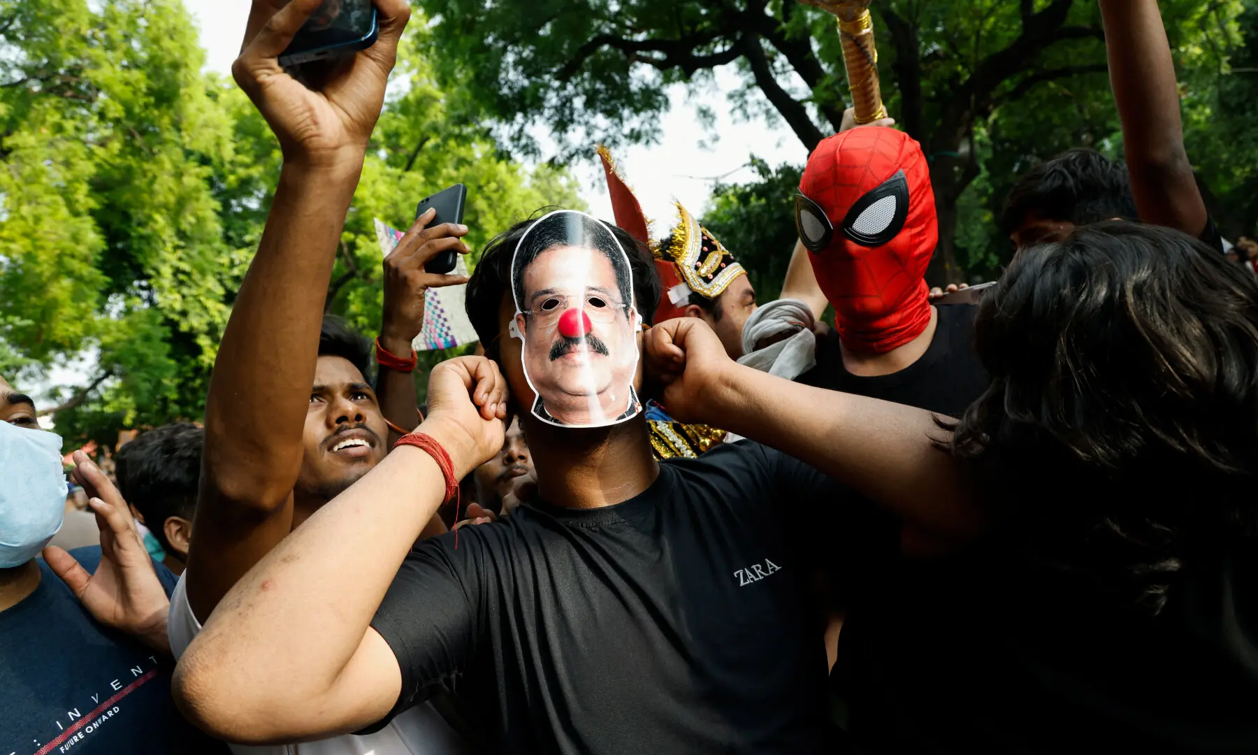  A supporter of India’s Cockroach Janta Party (CJP) celebrates as he wears a mask depicting India’s Education Minister Dharmendra Pradhan who resigned, in New Delhi on July 25, 2026. — Reuters 