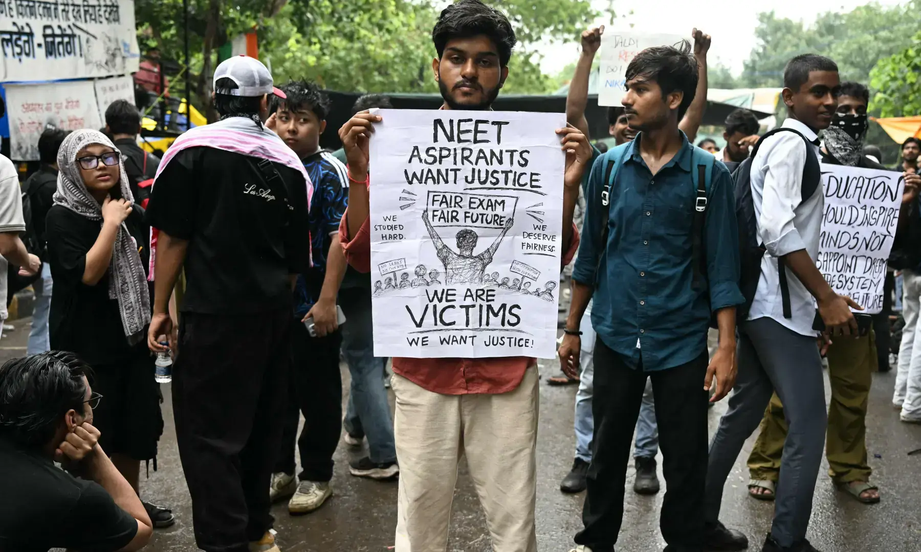 A Cockroach Janta Party supporter holds a placard at Jantar Mantar in New Delhi on July 22, 2026 during the ongoing protest to demand the resignation of India's Education Minister Dharmendra Pradhan over alleged NEET exam irregularities. — AFP/File A Cockroach Janta Party supporter holds a placard at Jantar Mantar in New Delhi on July 22, 2026 during the ongoing protest to demand the resignation of India's Education Minister Dharmendra Pradhan over alleged NEET exam irregularities. — AFP/File
