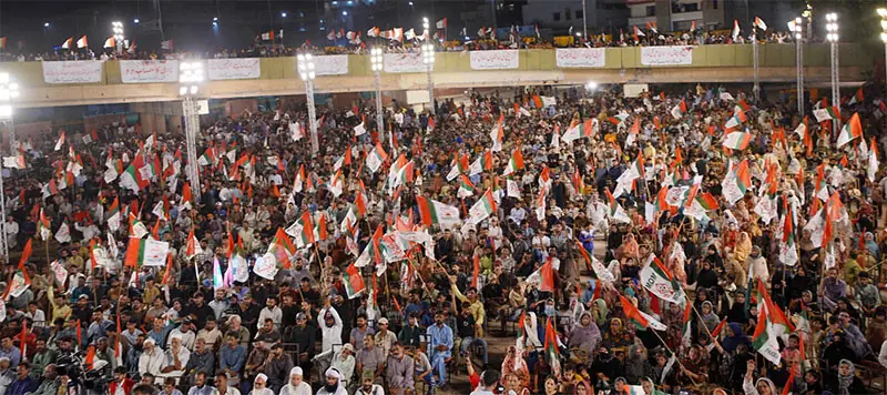 MQM-P workers and supporters wave party flags during the speech of senior leader Mustafa Kamal on Sunday evening.—Dawn MQM-P workers and supporters wave party flags during the speech of senior leader Mustafa Kamal on Sunday evening.—Dawn