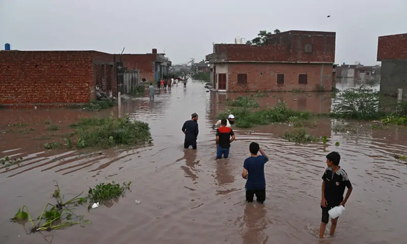 A view of Pathan Colony in Lahore, inundated with water from the overflowing Nullah Dek.&shy;&shy;&mdash;M. Arif / White Star