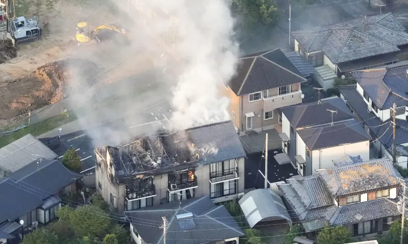 An aerial view shows a residential building on fire after an earthquake with a preliminary magnitude of 7.1 struck Japan&rsquo;s southern Kumamoto prefecture, in Yatsushiro, Kumamoto prefecture, Japan, July 28, 2026. &mdash; via Reuters