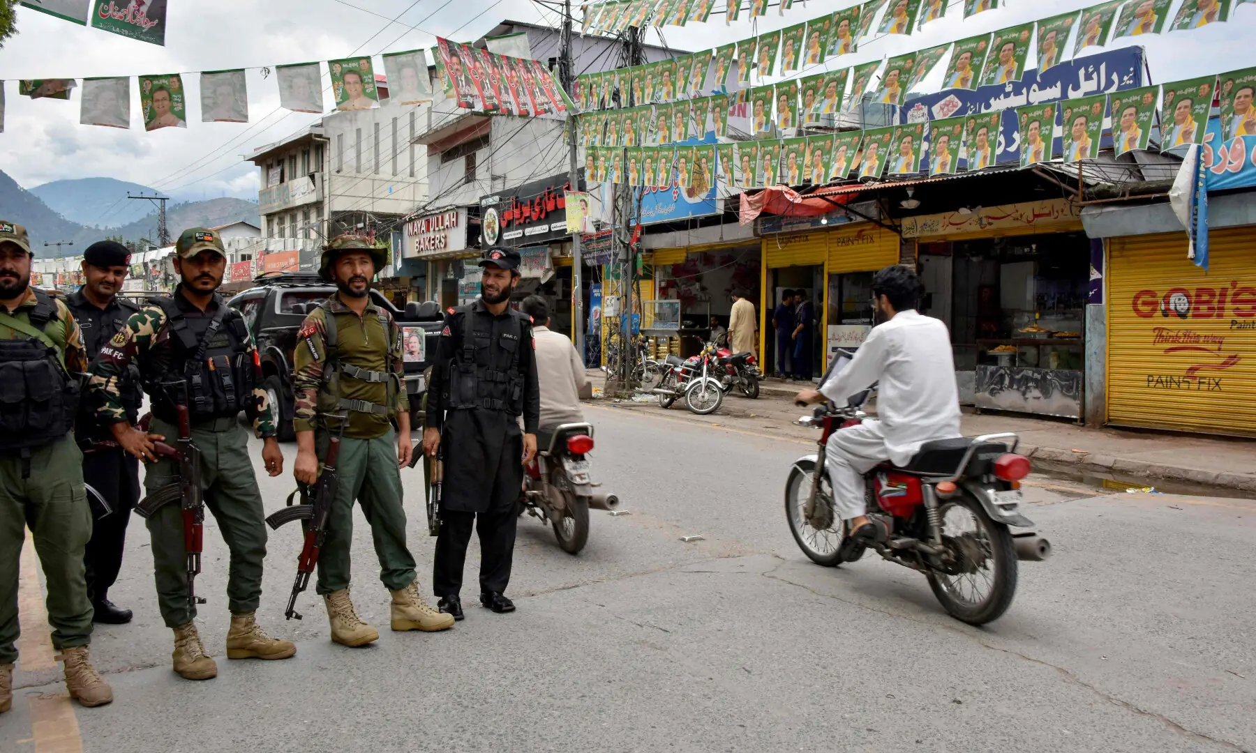 Federal Constabulary personnel stand guard along a street in AJK's Muzaffarabad on July 26, 2026, on the eve of the first phase of the regional elections. — AFP Federal Constabulary personnel stand guard along a street in AJK's Muzaffarabad on July 26, 2026, on the eve of the first phase of the regional elections. — AFP