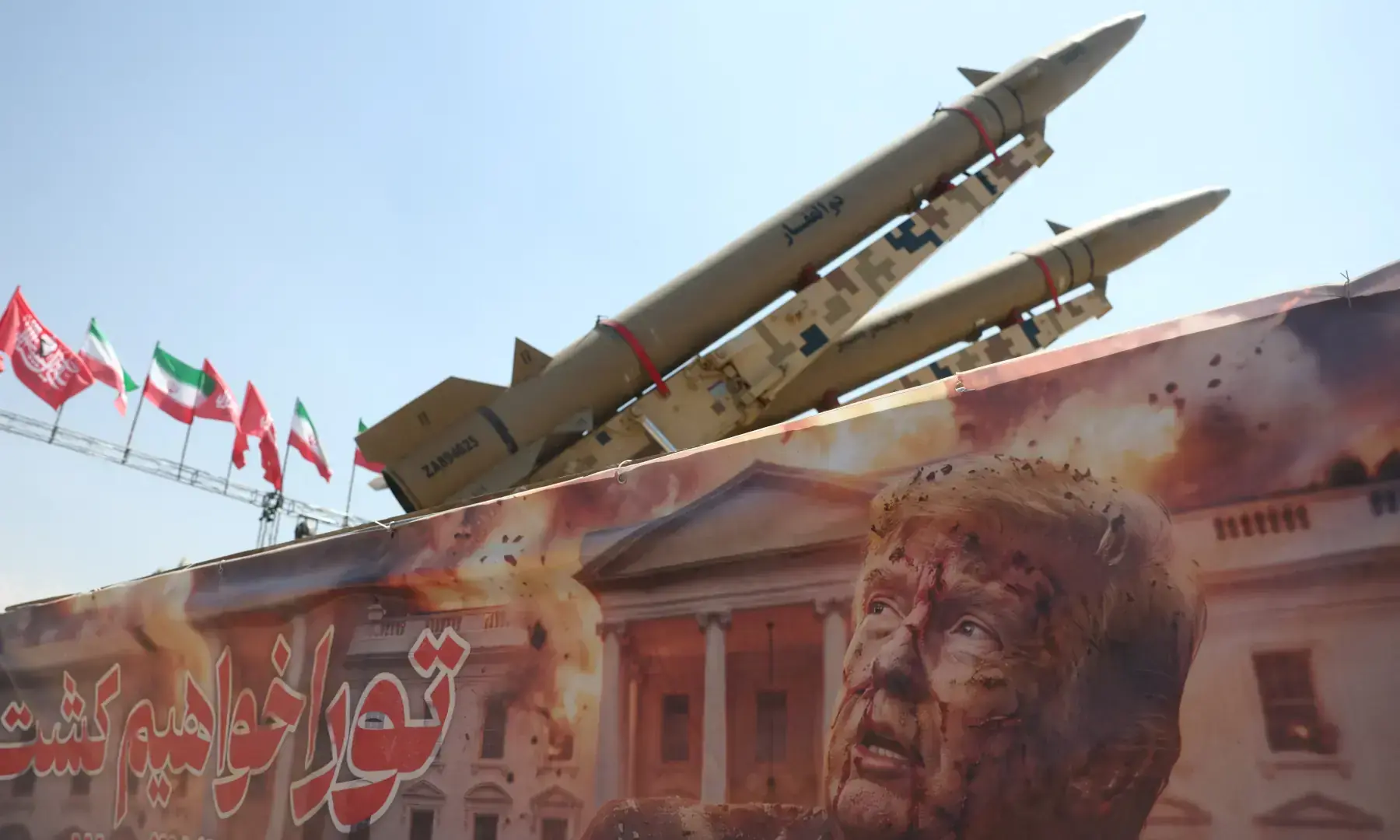 A banner with a picture of US President Donald Trump next to an Iranian missile system at Azadi Square in Tehran, Iran, on July 30, 2026. &mdash; WANA via Reuters