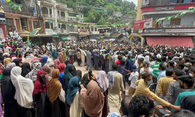 KOTLI: People gather during a protest by the proscribed Joint Awami Action Committee outfit.—Reuters KOTLI: People gather during a protest by the proscribed Joint Awami Action Committee outfit.—Reuters