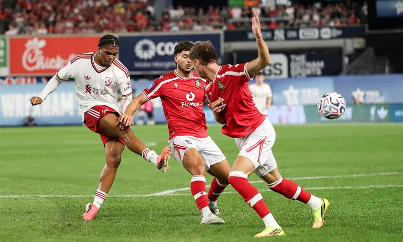 LIVERPOOL’S Rio Ngumoha (L) shoots to score during the pre-season friendly against Wrexham at the Yankee Stadium.—AFP LIVERPOOL’S Rio Ngumoha (L) shoots to score during the pre-season friendly against Wrexham at the Yankee Stadium.—AFP