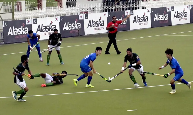 Players of Pakistan and South Korea in action during the first match of their Test series at the Naseer Bunda Hockey Stadium on Thursday.—APP Players of Pakistan and South Korea in action during the first match of their Test series at the Naseer Bunda Hockey Stadium on Thursday.—APP