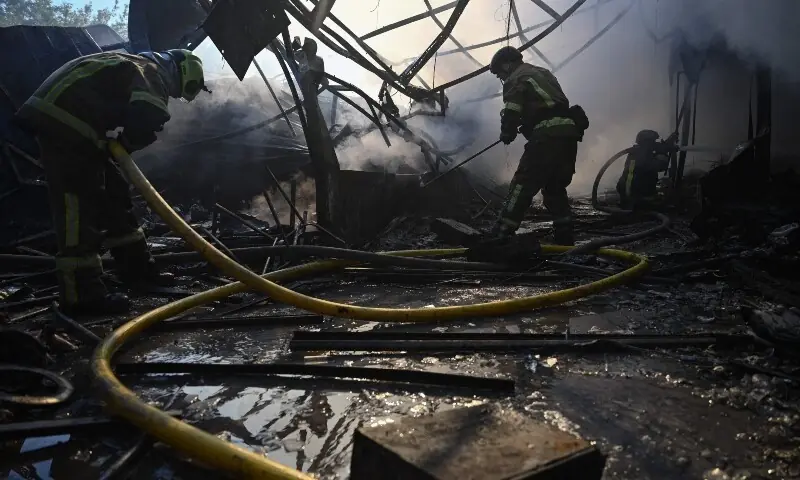 Ukrainian firefighters work to extinguish a fire at a market following a Russian missile strike in Kyiv on July 30, 2026, amid the Russian invasion of Ukraine. &mdash; AFP