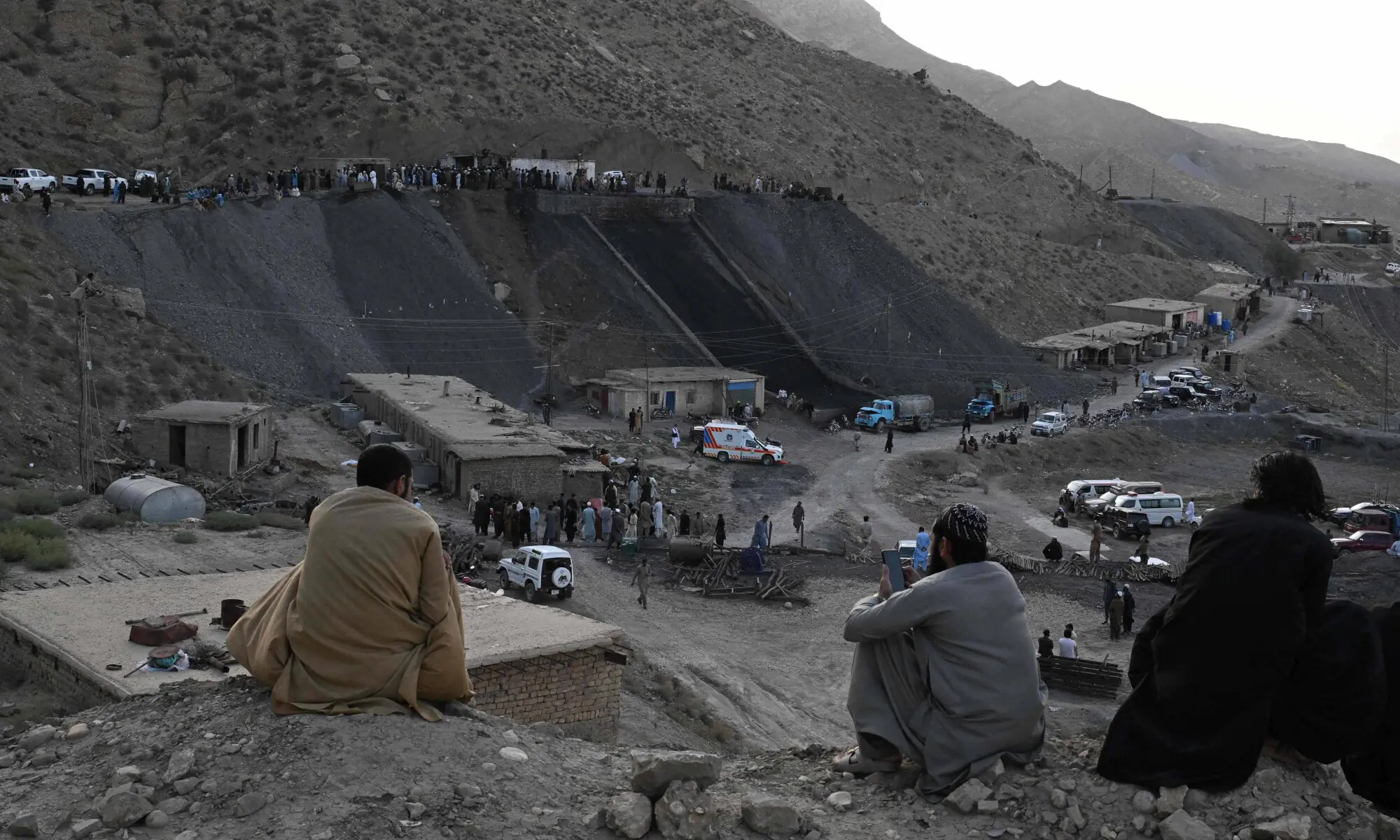 Coal miners and relatives gather after a coal mine collapsed in the Surange area, some 50 kilometres east of Quetta, on July 30, 2026. &mdash; AFP