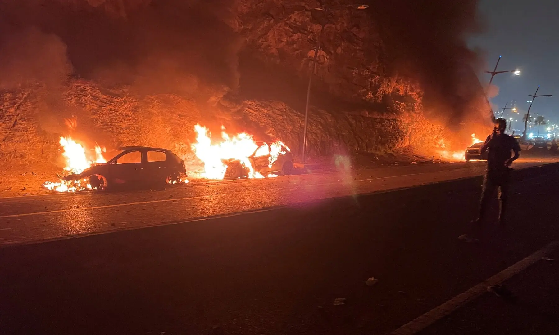 Vehicles burn in Fnideq, Morocco, July 31, 2026, as migrants (not pictured) wait for a chance to cross to the Spanish enclave of Ceuta. — Reuters