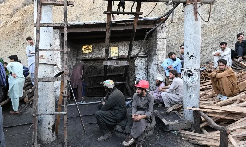 Coal miners and relatives gather at the entrance of a coal mine after it collapsed in the Surange area, some 50 kilometres east of Quetta, on July 30, 2026. &mdash;AFP